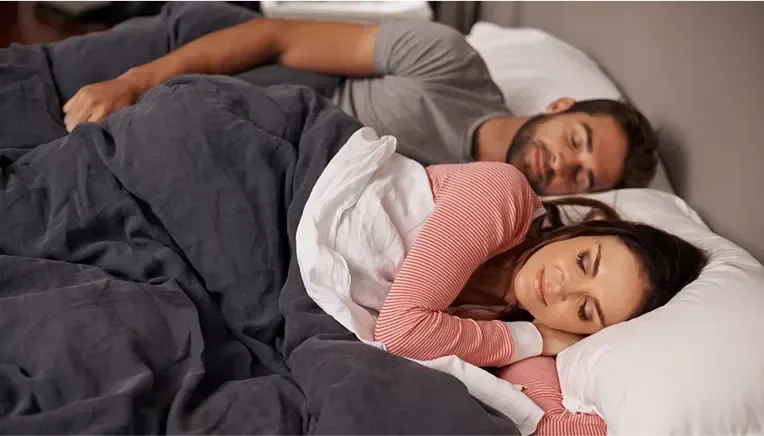  couple sleeping peacefully together
